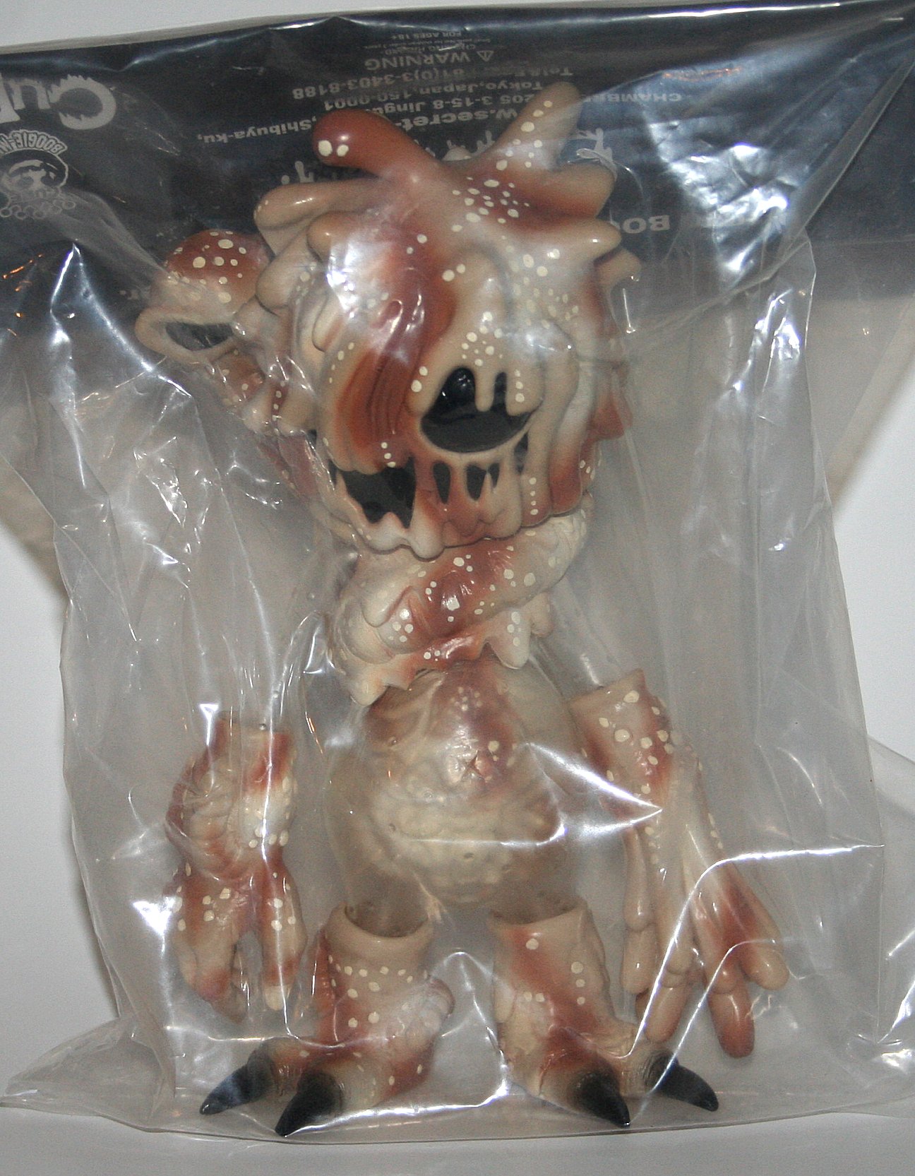 Cure x Secret Base 0-1000 Boogie Man in desert camo paint on light brown vinyl