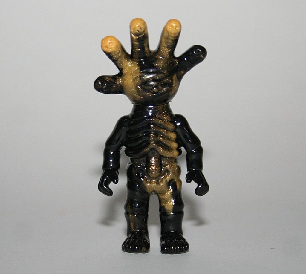 Secret Base Hand Face Gold and Black Micro Infection Monster