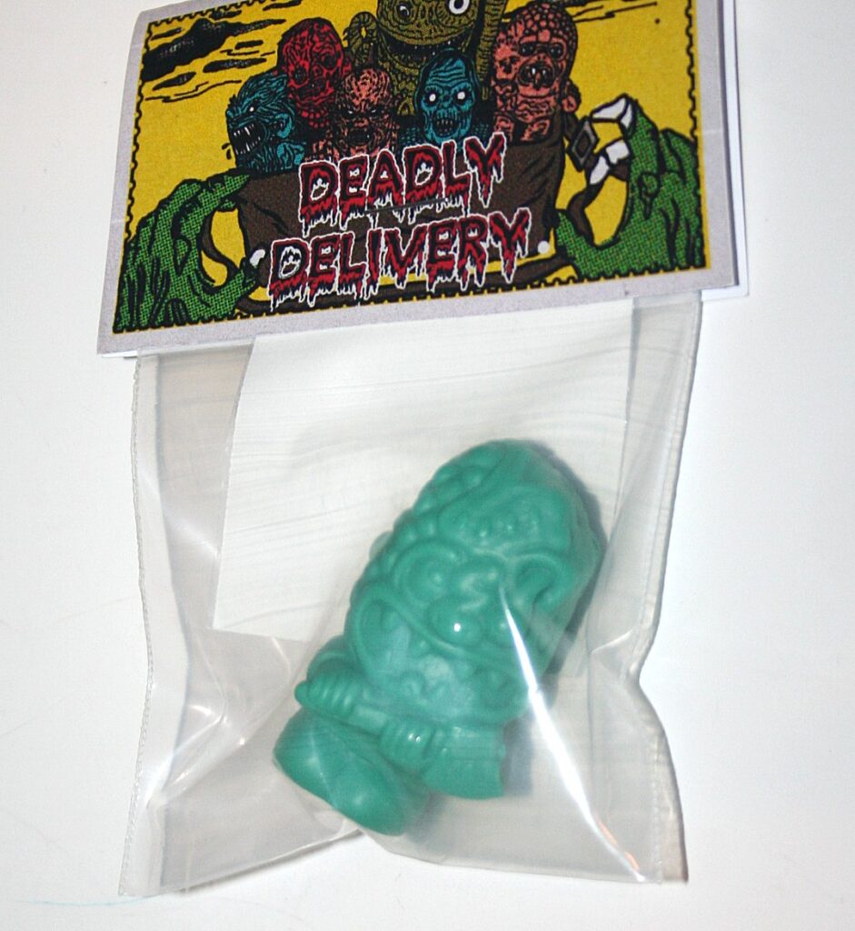 Deadly Delivery Greenish Lizard with Axe Boy