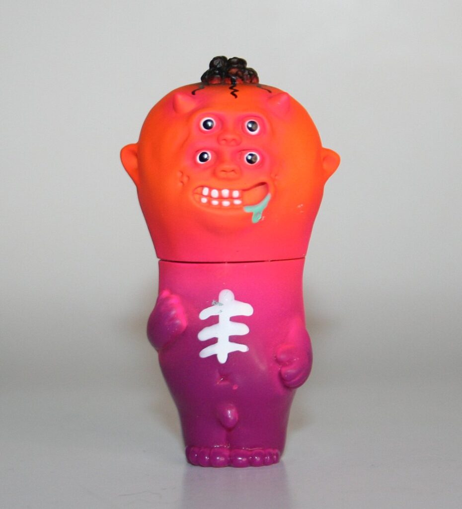 その他 DEATHLAND VINYL TOY Ultra Stone Age Man Deathland Vinyl Toys Orange Head Ultra Stone Age Man — Vicious Fun