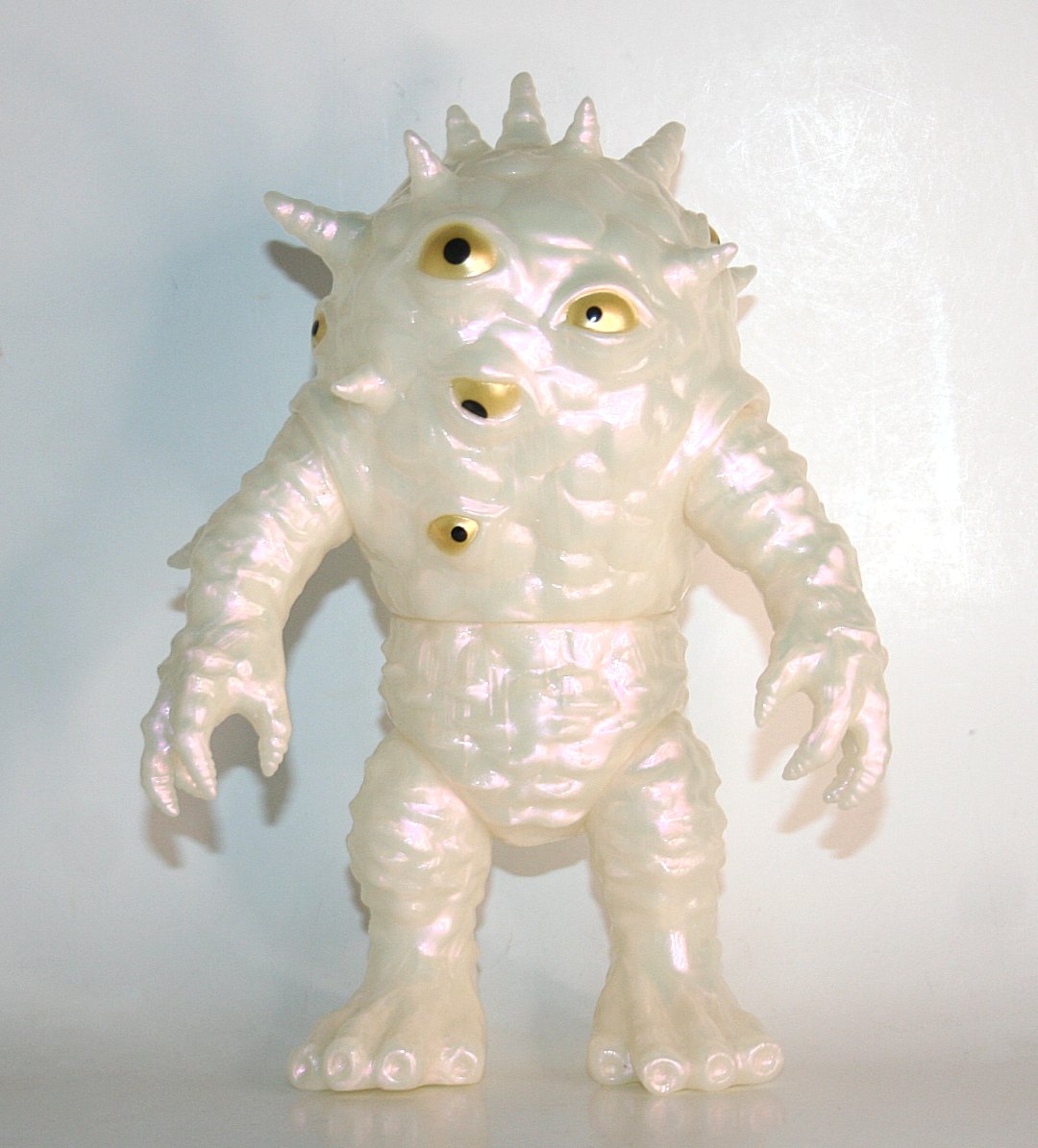 Max Toy Golden Eye Iridescent Kaiju Eyezon sofubi with teal shimmer