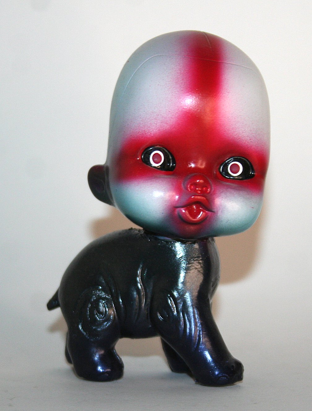 Grody Shogun Norwegian Death Pony black sofubi pony with red and white paint
