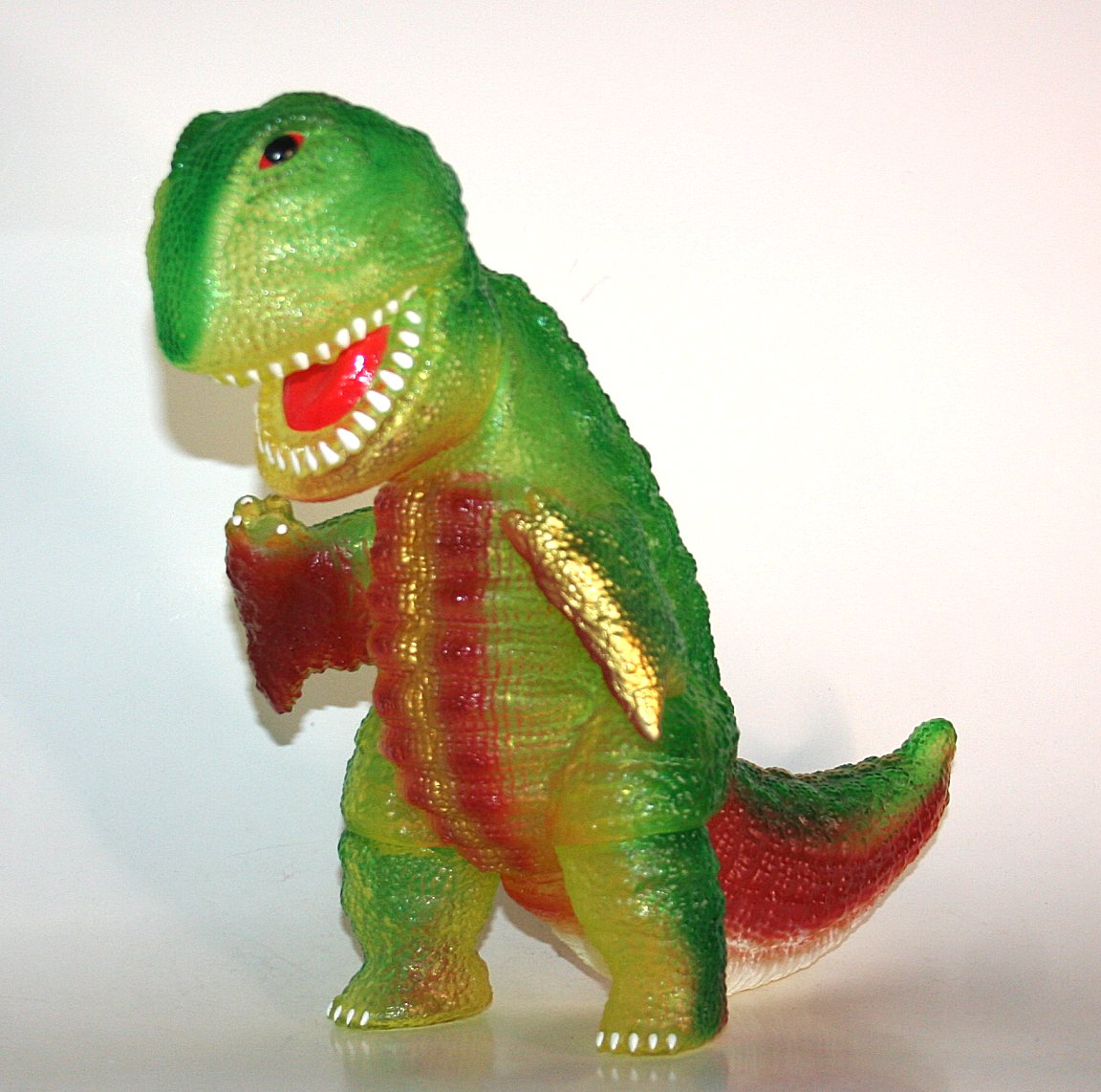 Anraku Ansaku x Medicom Migomori Gogamejira sofubi in clear greenish vinyl with brown, gold and white paint