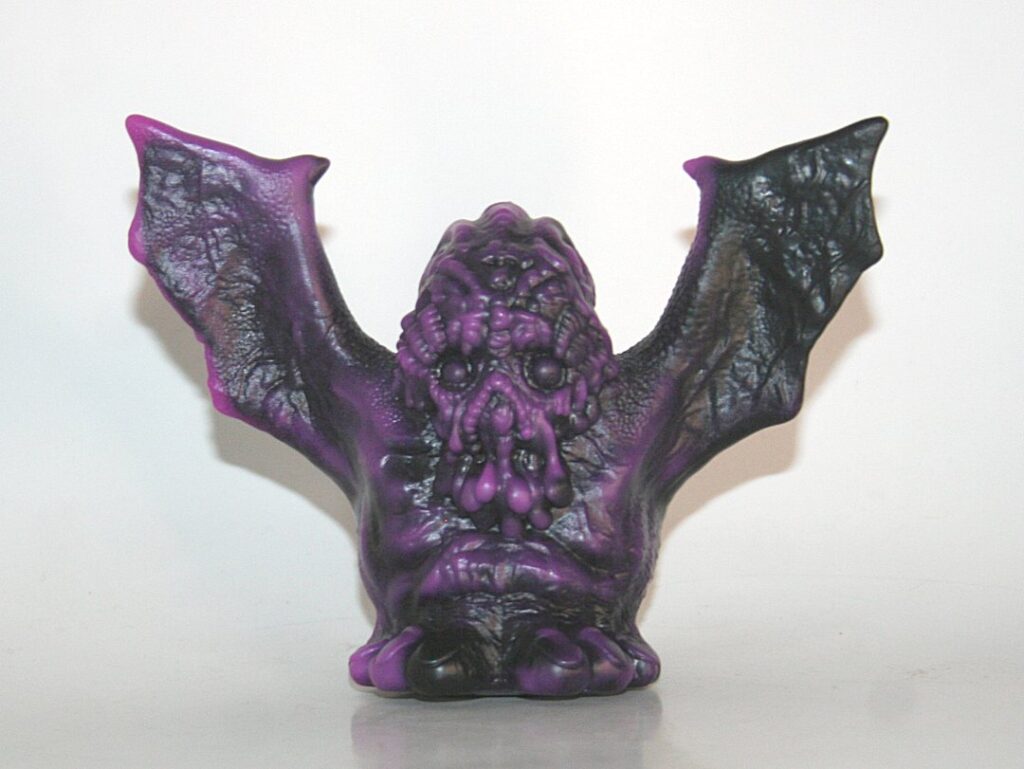 We Become Monsters Black x Purple Bat Thing